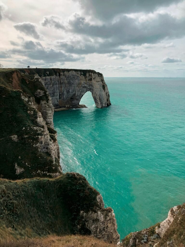 Breathtaking view of the iconic Elephant Rock in Étretat, France under a serene sky