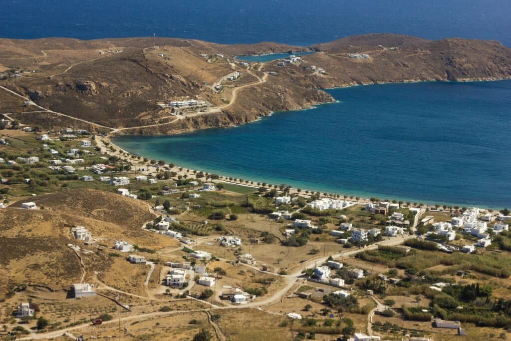 Aerial view of Serifos with its coastline, rural landscape, and tranquil sea.